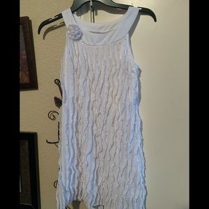 Cute white ruffle dress with rose accent